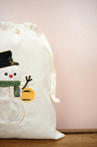 Snowman with Lantern on Light Canvas Medium Drawstring Pouch