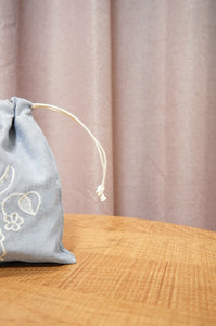 Gemma on Blue Chambray Mini Drawstring Pouch